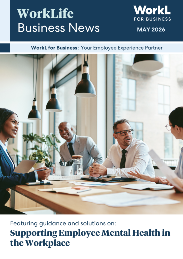 A magazine cover for "WorkLife Business News May 2026" featuring a diverse group of four professionals collaborating and smiling around a wooden conference table in a modern office setting.